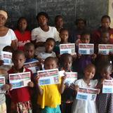 Some of the sponsored students with picture of their sponsors