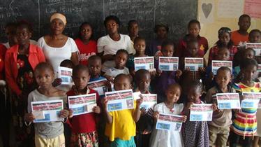 Some of the sponsored students with picture of their sponsors