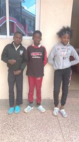 Three of our sponsored students at Gibens