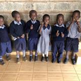 Kibera Nursary - Six students with thumbs up