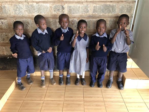 Kibera Nursary - Six students with thumbs up