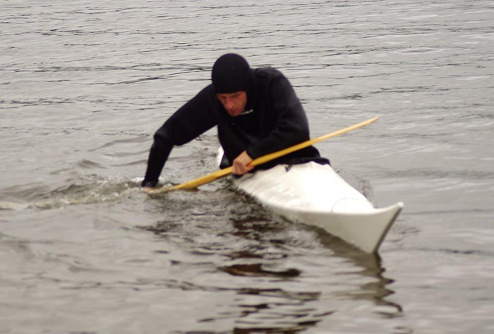 Snap the kayak upright with your hips.