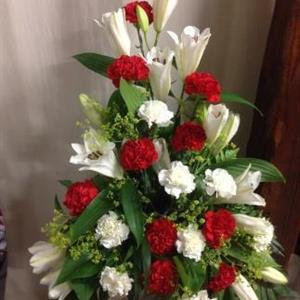 Stående dekoration med röda och vita blommor