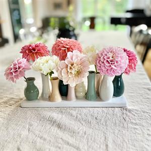 10 vaser på rad i vitt 